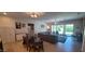 Open concept living room and dining area, filled with natural light and ample seating at 20838 E Vía De Arboles --, Queen Creek, AZ 85142