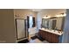 Bright main bathroom featuring a separate shower, soaking tub, and double sink vanity at 20838 E Vía De Arboles --, Queen Creek, AZ 85142