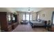 Spacious main bedroom with ceiling fan and sitting area and large windows to the backyard at 20838 E Vía De Arboles --, Queen Creek, AZ 85142