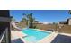 Inviting backyard pool with slide, surrounded by lush landscaping for private outdoor enjoyment at 20838 E Vía De Arboles --, Queen Creek, AZ 85142