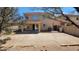 Expansive back yard featuring a covered patio, mature trees, and private block fence at 22320 W Morning Glory St, Buckeye, AZ 85326