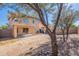 Home featuring a spacious backyard with a covered patio and neutral colored exterior at 22320 W Morning Glory St, Buckeye, AZ 85326