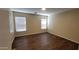 Spacious bedroom features wood-look floors, neutral paint, and natural light at 22320 W Morning Glory St, Buckeye, AZ 85326
