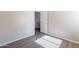 Bedroom featuring vinyl flooring, neutral walls, and an open doorway to an adjacent room at 22320 W Morning Glory St, Buckeye, AZ 85326