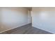 Bedroom showcasing vinyl flooring, light walls, and multiple electrical outlets at 22320 W Morning Glory St, Buckeye, AZ 85326