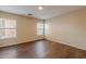 Bright, spacious bedroom features wood-look flooring and ample natural light at 22320 W Morning Glory St, Buckeye, AZ 85326