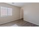 Bright bedroom featuring vinyl flooring and a window allowing for ample natural light at 22320 W Morning Glory St, Buckeye, AZ 85326