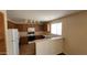 Kitchen area featuring ample counter space, white appliances, and wood cabinets at 22320 W Morning Glory St, Buckeye, AZ 85326