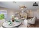 Bright living room and dining area features neutral tones and an elegant modern decor at 22320 W Morning Glory St, Buckeye, AZ 85326