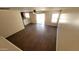 Upstairs living room featuring wood-look floors and access to kitchen area at 22320 W Morning Glory St, Buckeye, AZ 85326
