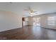 View of the living room that leads to an outdoor patio and the kitchen at 22320 W Morning Glory St, Buckeye, AZ 85326