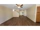 Open-concept living room featuring wood-look floors and neutral paint at 22320 W Morning Glory St, Buckeye, AZ 85326