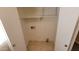 Storage area with shelving, neutral paint, tile flooring, and accessible outlets suitable for laundry or utilities at 22320 W Morning Glory St, Buckeye, AZ 85326