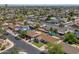 An aerial view of a suburban community with tree-lined streets and well-maintained homes at 2329 S Elm --, Mesa, AZ 85202