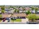 Aerial view of a home with a manicured front yard, mature trees, and proximity to neighborhood amenities at 2329 S Elm --, Mesa, AZ 85202