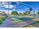 Well-maintained outdoor basketball court surrounded by lush greenery and a serene lake backdrop at 2329 S Elm --, Mesa, AZ 85202