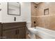 Bathroom showcasing a modern vanity, soaking tub, and a beautifully tiled shower at 2329 S Elm --, Mesa, AZ 85202