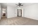 An empty bedroom with a neutral carpet, modern ceiling fan and freshly painted walls at 2329 S Elm --, Mesa, AZ 85202