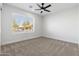 Bedroom showcasing a window with outside views, fresh paint and carpet at 2329 S Elm --, Mesa, AZ 85202