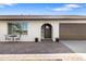Charming home featuring a brick-paved entryway, brown door, and a brown garage door at 2329 S Elm --, Mesa, AZ 85202