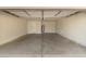 Spacious two car garage with concrete floor and door to house at 2329 S Elm --, Mesa, AZ 85202