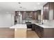 Modern kitchen featuring stainless steel appliances, a center island, and stylish cabinetry at 2329 S Elm --, Mesa, AZ 85202