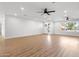 Spacious living room with modern flooring, ceiling fans, recessed lighting, and ample natural light at 2329 S Elm --, Mesa, AZ 85202