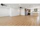 Open-concept living space featuring new flooring, abundant light, ceiling fans, and kitchen access at 2329 S Elm --, Mesa, AZ 85202