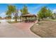 Covered picnic area with tables, surrounded by trees and lakeside views at 2329 S Elm --, Mesa, AZ 85202