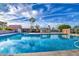 Spacious community pool featuring clear blue water, poolside seating, and well-maintained surroundings at 2329 S Elm --, Mesa, AZ 85202
