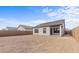 Backyard featuring a spacious yard and modern home exterior, perfect for outdoor activities and relaxation at 23385 W Burton Ave, Buckeye, AZ 85326