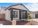 Cozy single-Gathering home with a charming front porch and a well-maintained yard and a two-car garage at 23385 W Burton Ave, Buckeye, AZ 85326