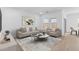Cozy living room with neutral decor, showcasing comfortable seating and bright natural light at 23385 W Burton Ave, Buckeye, AZ 85326