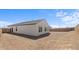 Spacious backyard features ample space for customization, enclosed by a sturdy block wall for privacy at 23456 W Fulton St, Buckeye, AZ 85326
