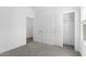 Empty bedroom with closet and entrance door at 23456 W Fulton St, Buckeye, AZ 85326