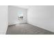 Empty bedroom with carpet and window to neighborhood at 23456 W Fulton St, Buckeye, AZ 85326