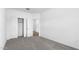 Empty bedroom with closet and entrance door at 23456 W Fulton St, Buckeye, AZ 85326