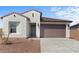 Charming single-story home featuring a brown tile roof and a two-car garage at 23456 W Fulton St, Buckeye, AZ 85326