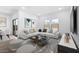 Cozy living room boasts stylish decor, comfortable seating, and abundant natural light at 23456 W Fulton St, Buckeye, AZ 85326