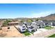 Scenic aerial view of neighborhood homes displaying modern design, three car garages, and large lots at 26619 S 169Th Pl, Queen Creek, AZ 85142