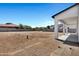 View from covered patio showcasing the expansive, undeveloped backyard with concrete patio at 26619 S 169Th Pl, Queen Creek, AZ 85142