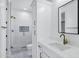 Elegant bathroom boasts a tiled shower, brass hardware, white countertops and cabinets at 26619 S 169Th Pl, Queen Creek, AZ 85142