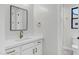 Elegant bathroom with white cabinetry, quartz countertop, gold hardware, and modern fixtures at 26619 S 169Th Pl, Queen Creek, AZ 85142