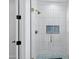Beautiful bathroom boasts a tiled shower with glass door, brass fixtures and hardware at 26619 S 169Th Pl, Queen Creek, AZ 85142