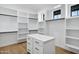 Walk in closet with an island in the middle and storage all around at 26619 S 169Th Pl, Queen Creek, AZ 85142