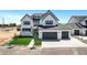 Beautiful new construction home with a three-car garage, artificial grass and modern design at 26619 S 169Th Pl, Queen Creek, AZ 85142