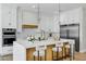 Modern kitchen with white cabinetry, a large center island, and stainless steel appliances at 26619 S 169Th Pl, Queen Creek, AZ 85142