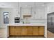 Gourmet kitchen with custom cabinets, large center island, and stainless steel appliances at 26619 S 169Th Pl, Queen Creek, AZ 85142