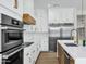 Updated kitchen features stainless steel appliances, white cabinets, and stylish hardware at 26619 S 169Th Pl, Queen Creek, AZ 85142