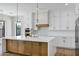 Modern kitchen features white cabinets, an island with seating, and pendant lighting at 26619 S 169Th Pl, Queen Creek, AZ 85142